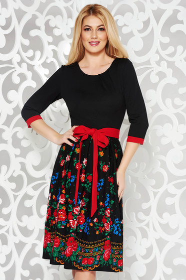 Black elegant cloche dress slightly elastic fabric with floral prints accessorized with tied waistband