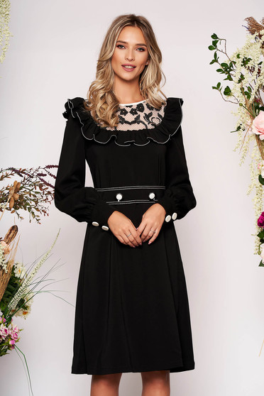 LaDonna black elegant dress from non elastic fabric with ruffle details with lace details accessorized with tied waistband