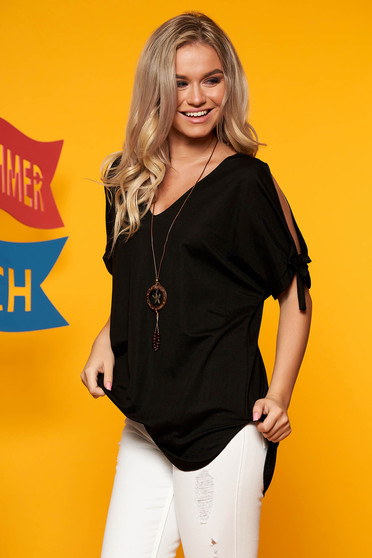 Black women`s blouse both shoulders cut out with v-neckline with an accessory