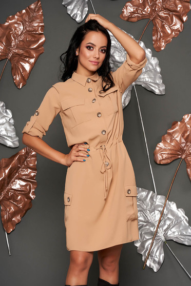 Cream dress casual short cut flared with pockets is fastened around the waist with a ribbon with buttons