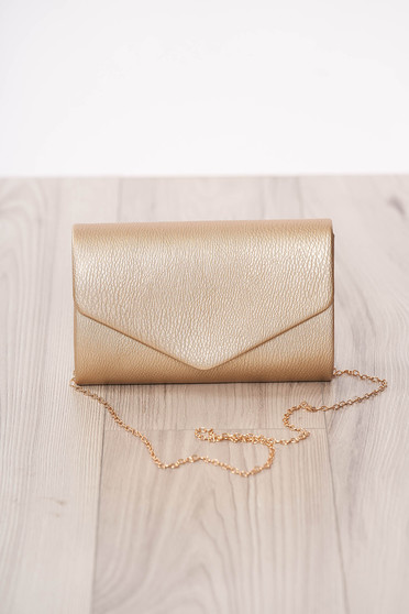 Bag clutch gold occasional from ecological leather metal eyelets fastening accessorized with chain